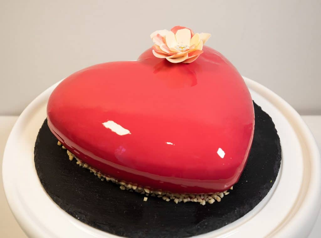 Heart-shaped mouse cake with glaze